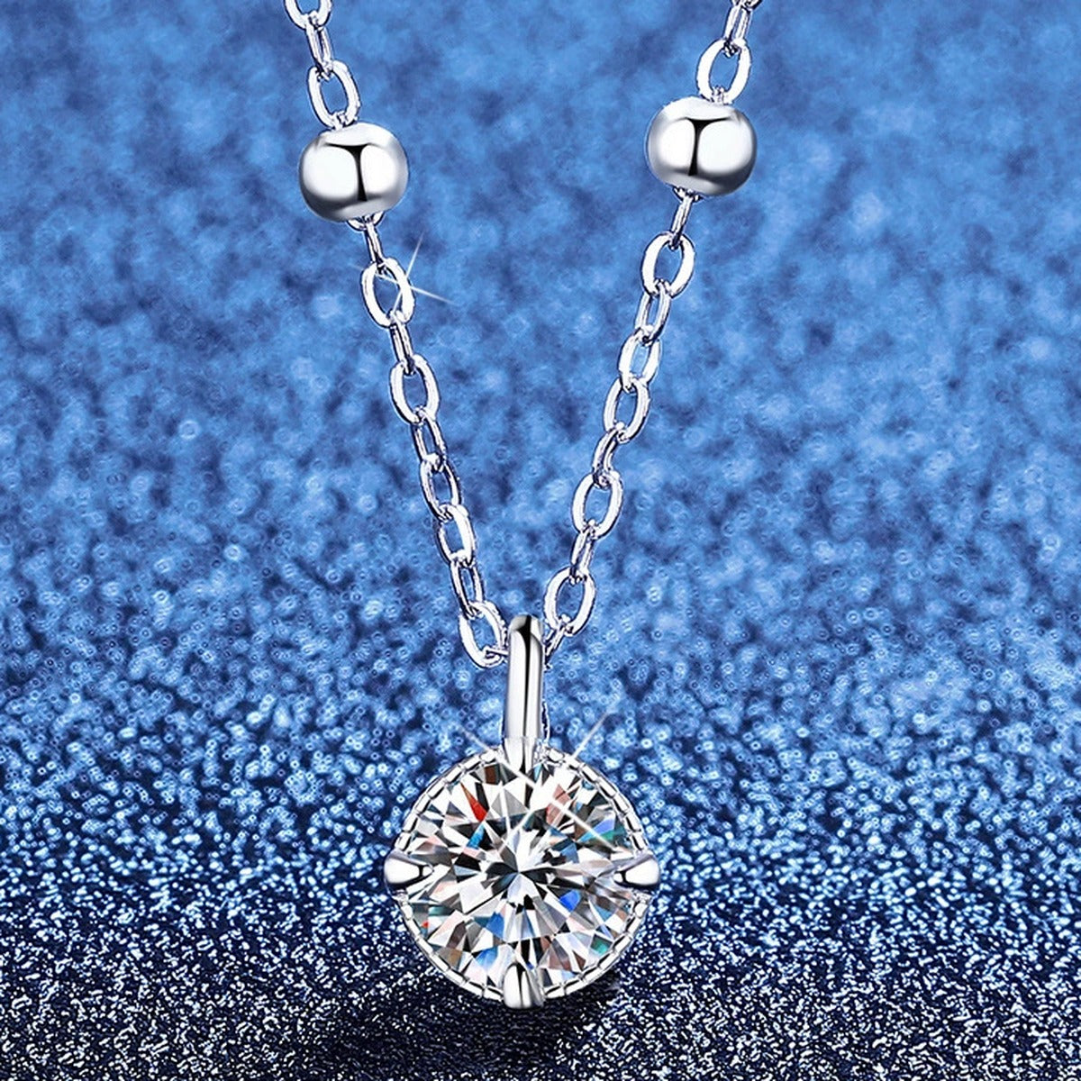 Solitaire Moissanite Pendant Necklace in Platinum-Plated S925 Sterling Silver blue background product view