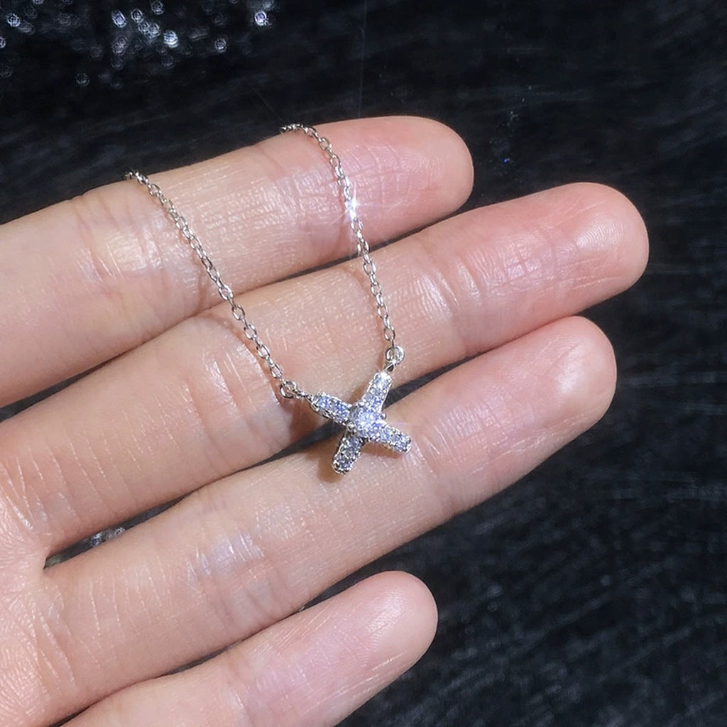 Petite X Moissanite Pendant Necklace with Cubic Zirconia in Platinum-Plated S925 Sterling Silver close-up product detail view