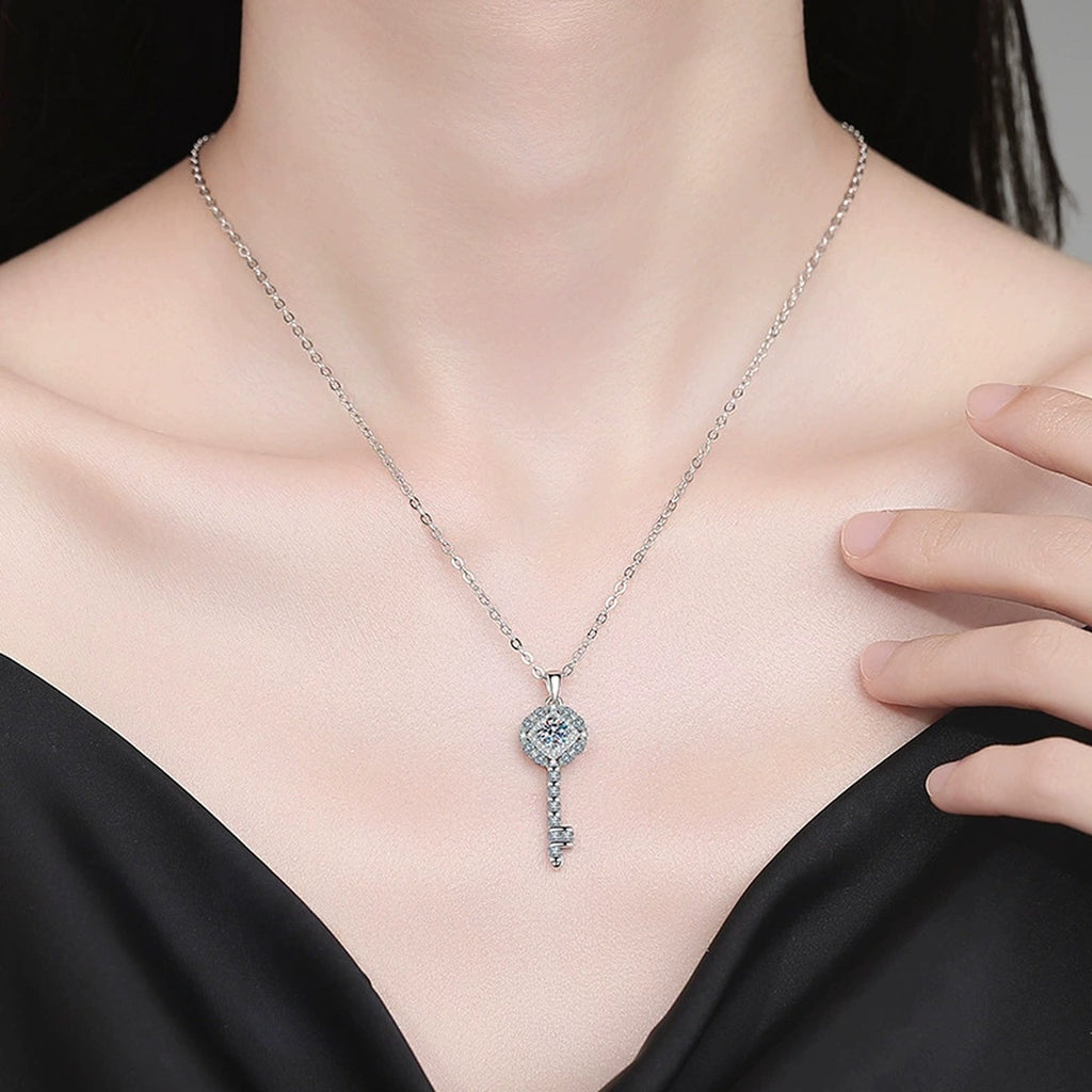 Key Moissanite Pendant Necklace with Cubic Zirconia in Platinum-Plated S925 Sterling Silver worn on neckline by model