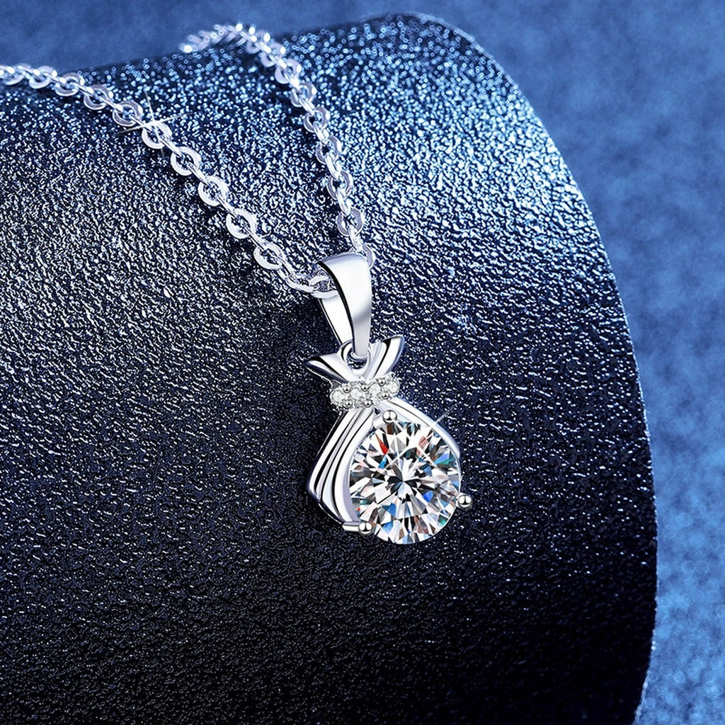 Pineapple Moissanite Pendant Necklace with Cubic Zirconia in Platinum-Plated S925 Sterling Silver blue background angled view