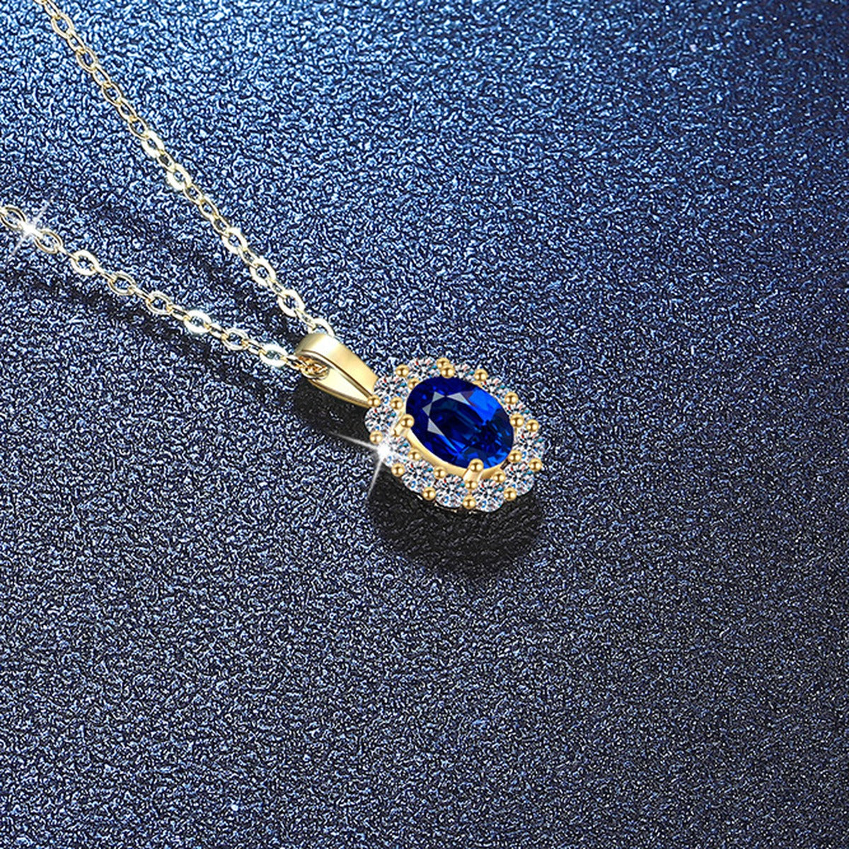 Oval Lab-Grown Gemstone and Moissanite Pendant Necklace in 18K Yellow Gold-Plated S925 Sterling Silver blue background close-up view