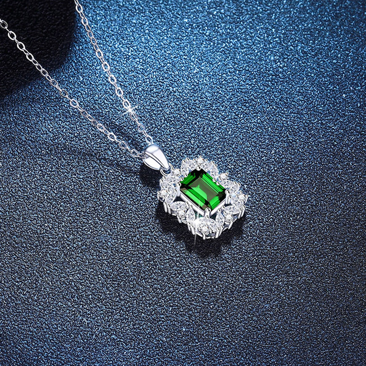 Emerald Cut Lab-Grown Gemstone and Moissanite Pendant Necklace in White Gold-Plated S925 Sterling Silver blue background close-up view
