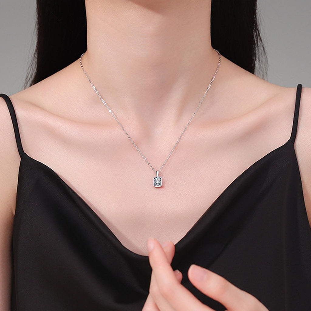 Emerald Cut Lab-Grown Gemstone and Moissanite Pendant Necklace in White Gold-Plated S925 Sterling Silver worn on neckline by model
