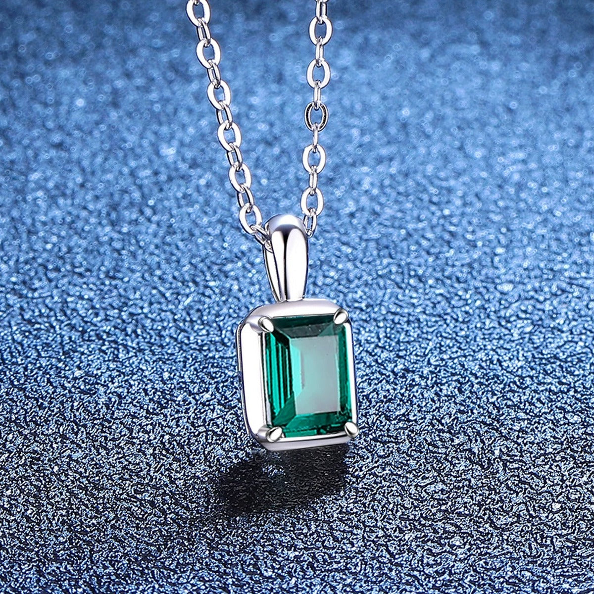 Emerald Cut Lab-Grown Gemstone and Moissanite Pendant Necklace in White Gold-Plated S925 Sterling Silver blue background close-up view