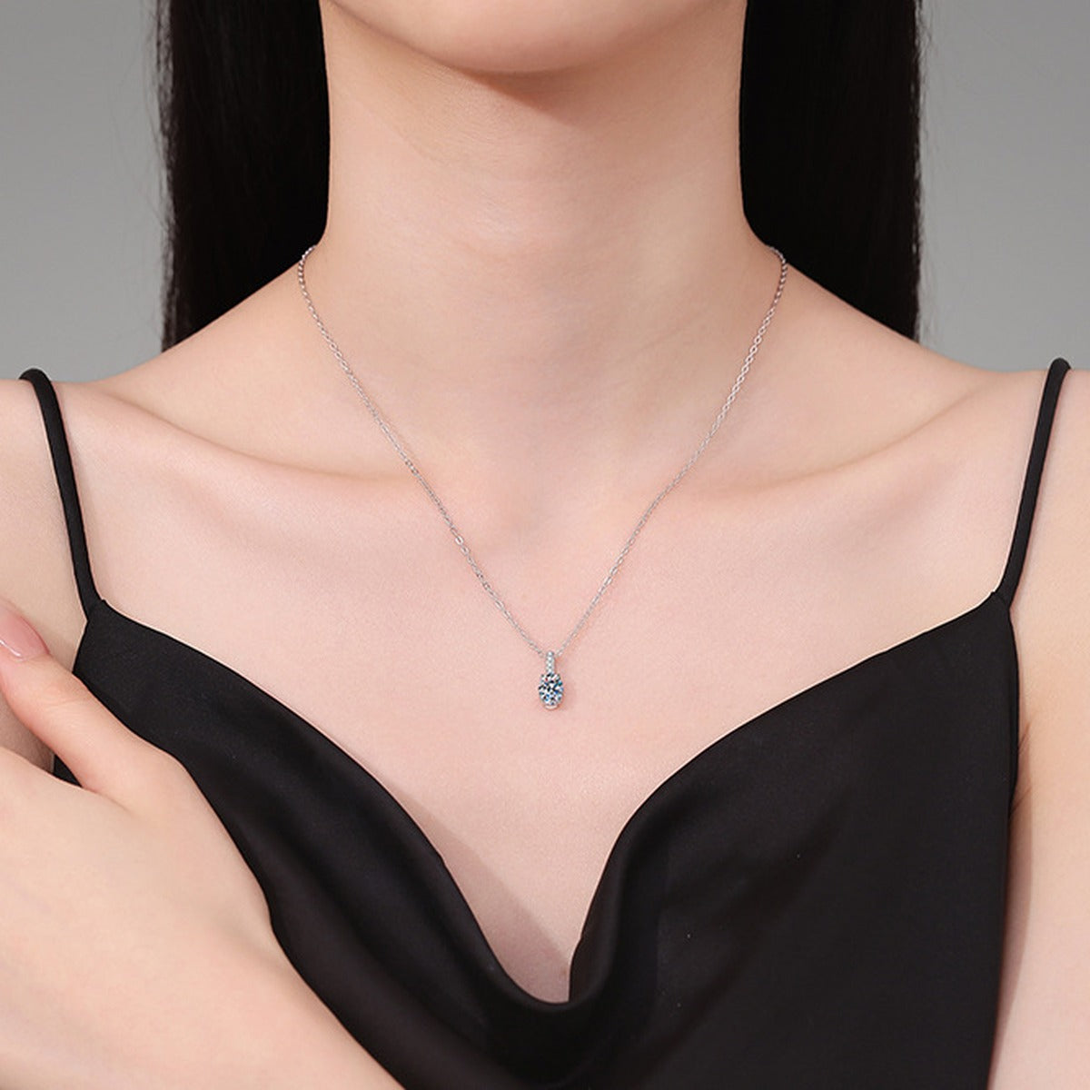 Oval Lab-Grown Gemstone and Moissanite Drop Necklace in White Gold-Plated S925 Sterling Silver worn on neckline by model