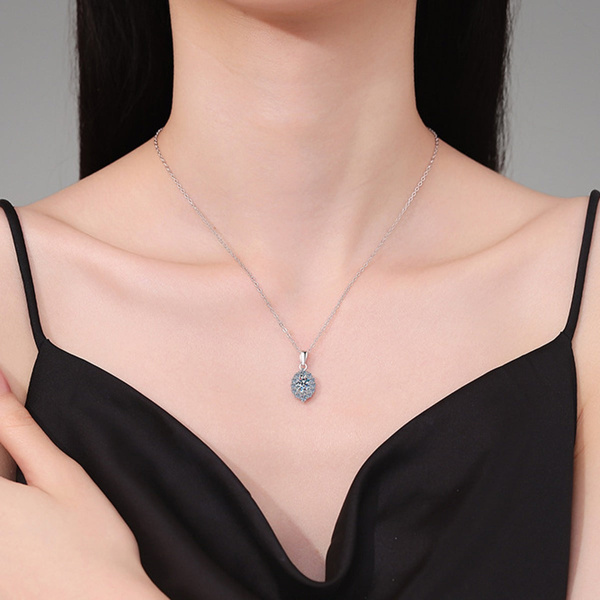 Oval Halo Lab-Grown Gemstone and Moissanite Pendant Necklace in White Gold-Plated S925 Sterling Silver worn on neckline by model