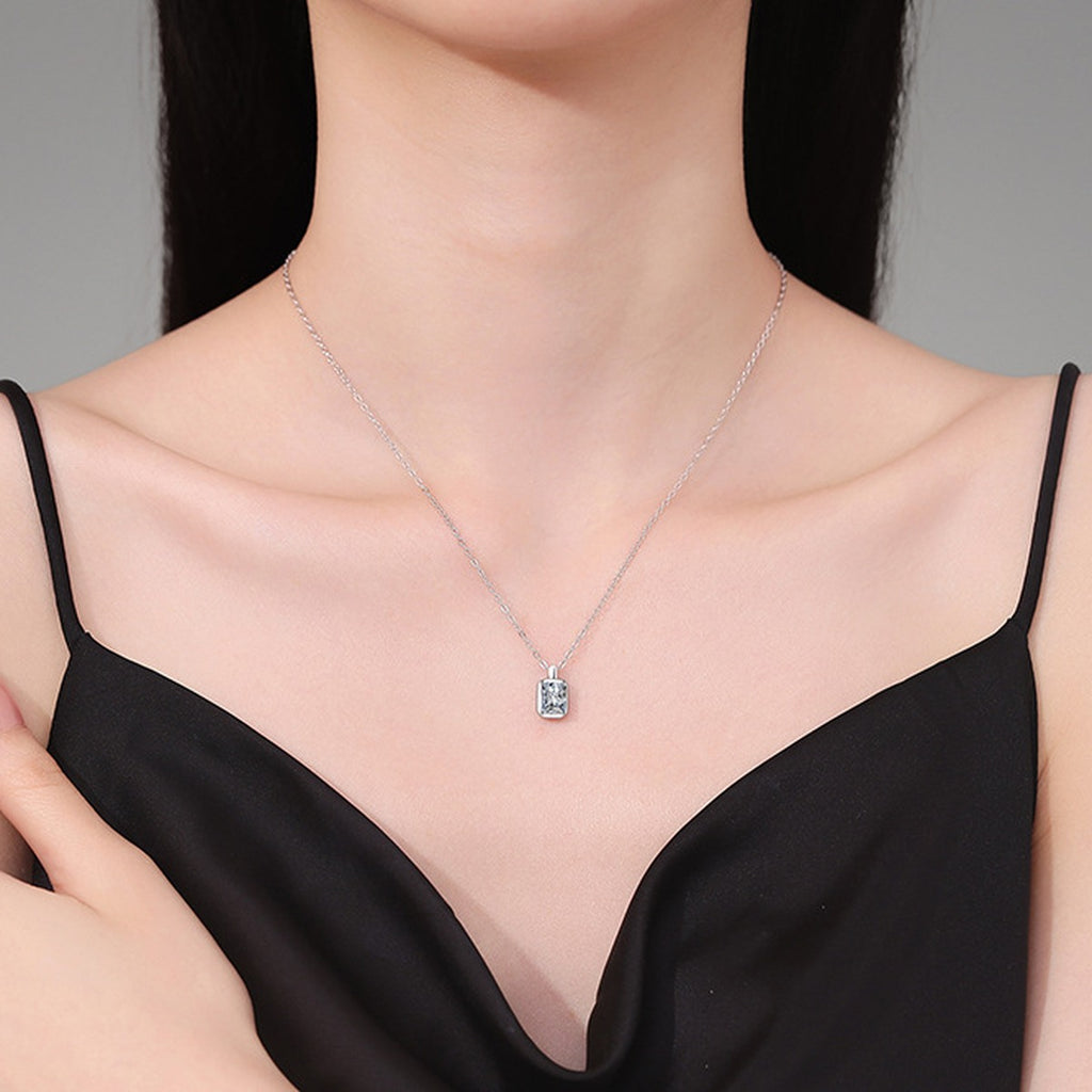 Emerald Cut Lab-Grown Gemstone and Moissanite Pendant Necklace in White Gold-Plated S925 Sterling Silver worn on neckline by model