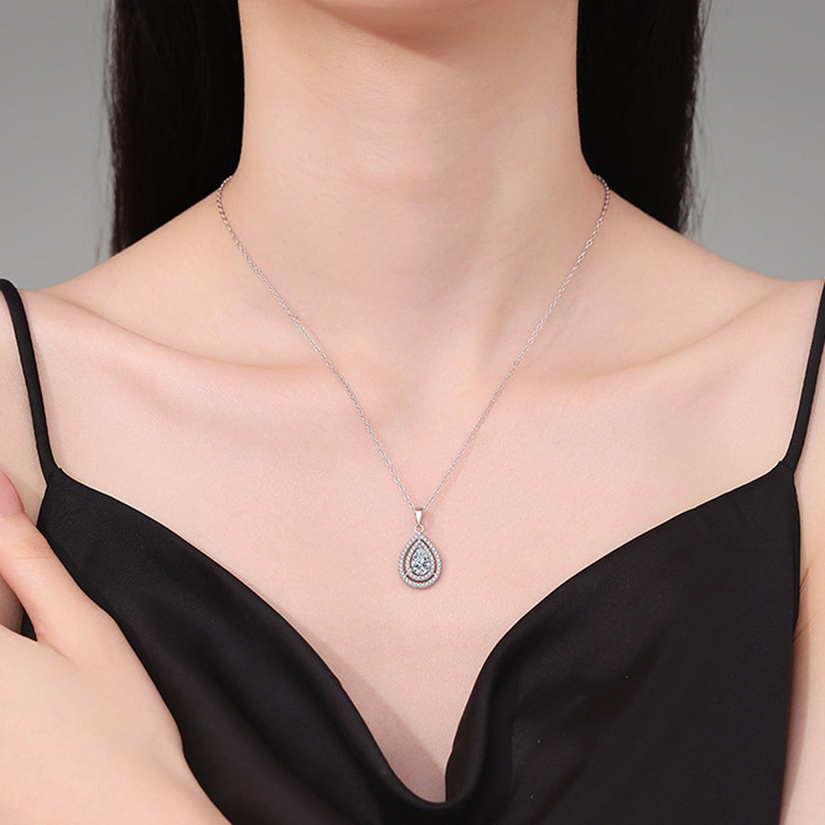 Pear Lab-Grown Gemstone and Moissanite Pendant Necklace in White Gold-Plated S925 Sterling Silver worn on neckline by model