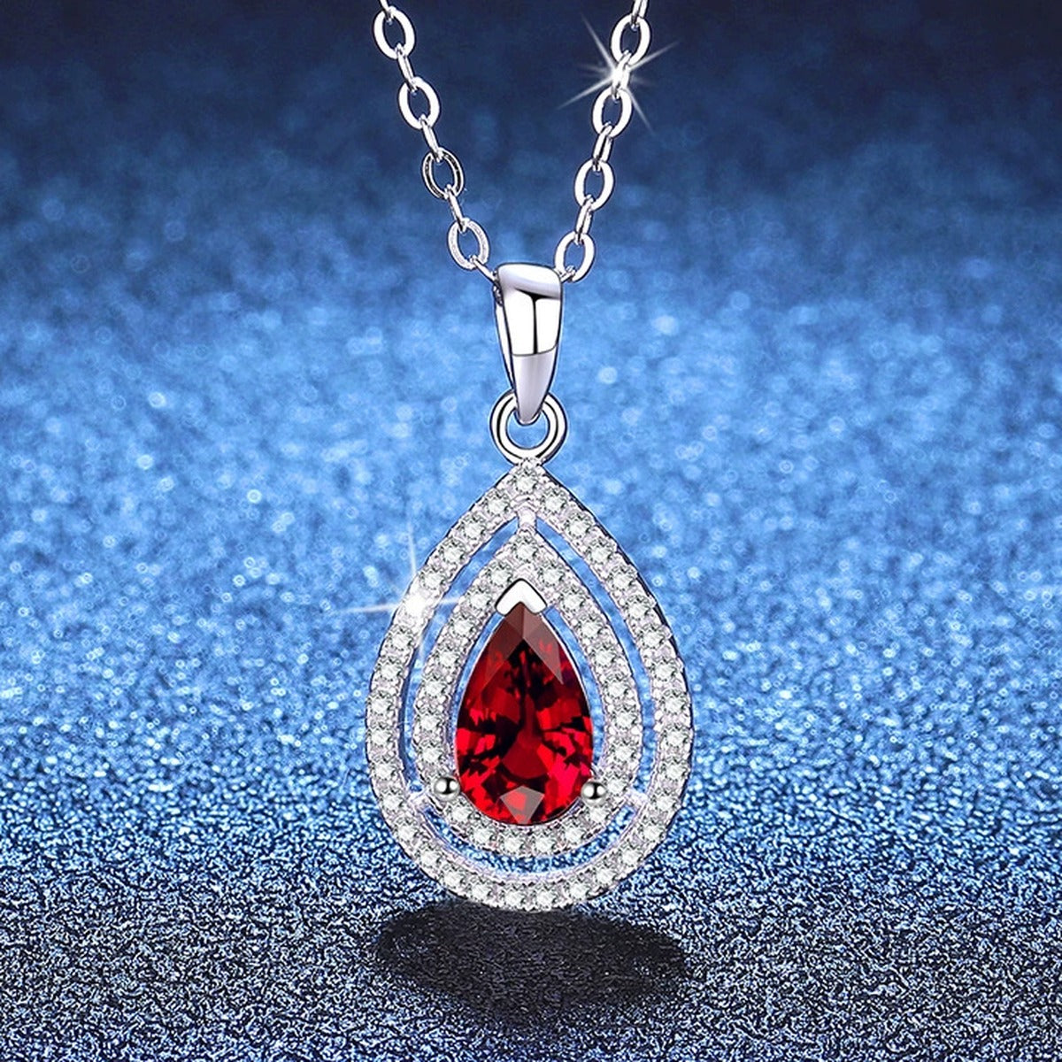Pear Lab-Grown Gemstone and Moissanite Pendant Necklace in White Gold-Plated S925 Sterling Silver blue background close-up view