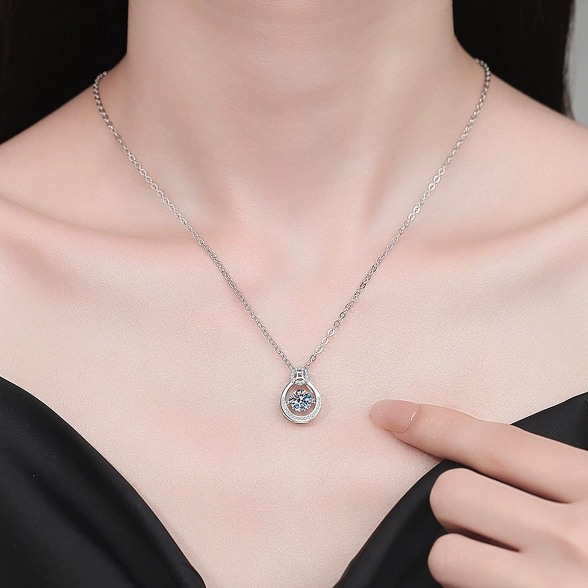 Oval Teardrop Moissanite Pendant Necklace with Cubic Zirconia in Platinum-Plated S925 Sterling Silver worn on neckline by model