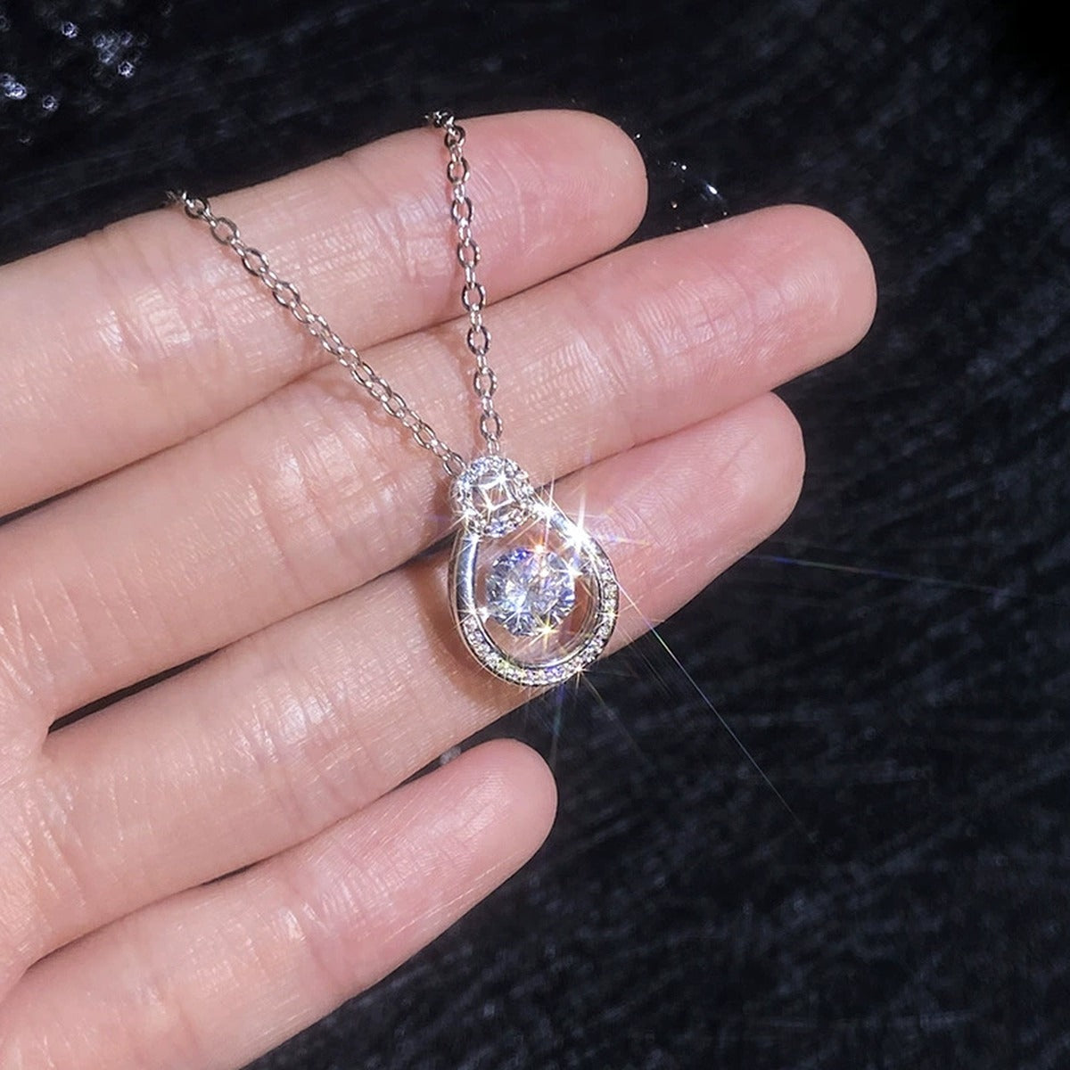 Oval Teardrop Moissanite Pendant Necklace with Cubic Zirconia in Platinum-Plated S925 Sterling Silver dark background product display view