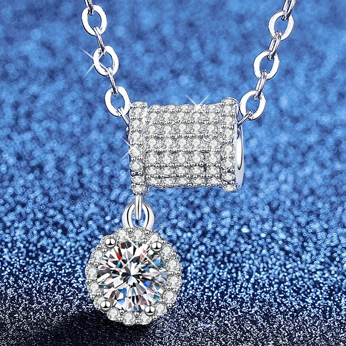 Square Station Moissanite Pendant Necklace with Cubic Zirconia in Platinum-Plated S925 Sterling Silver blue background angled view