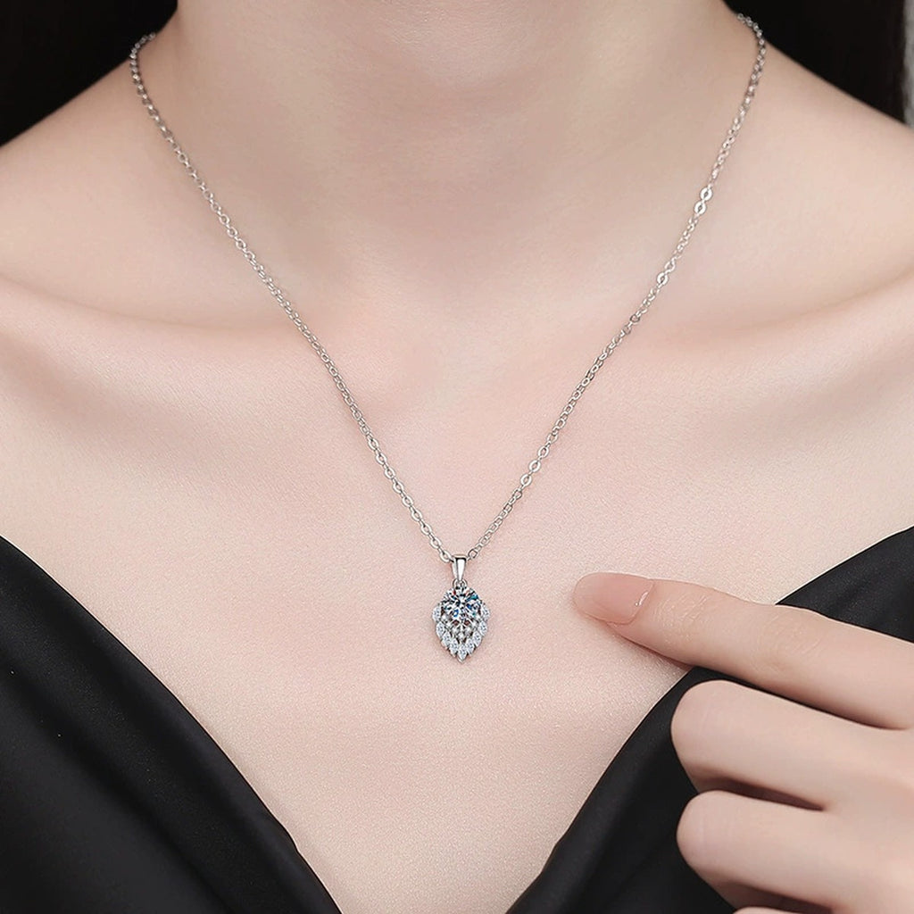 Pear Teardrop Moissanite Pendant Necklace with Cubic Zirconia in Platinum-Plated S925 Sterling Silver worn on neckline by model