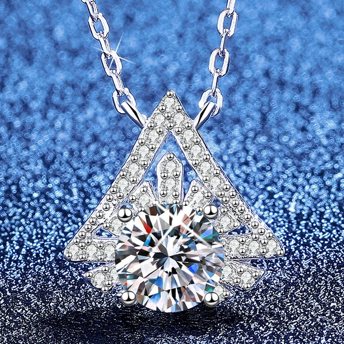 Kite Halo Moissanite Pendant Necklace with Cubic Zirconia in Platinum-Plated S925 Sterling Silver blue background angled view