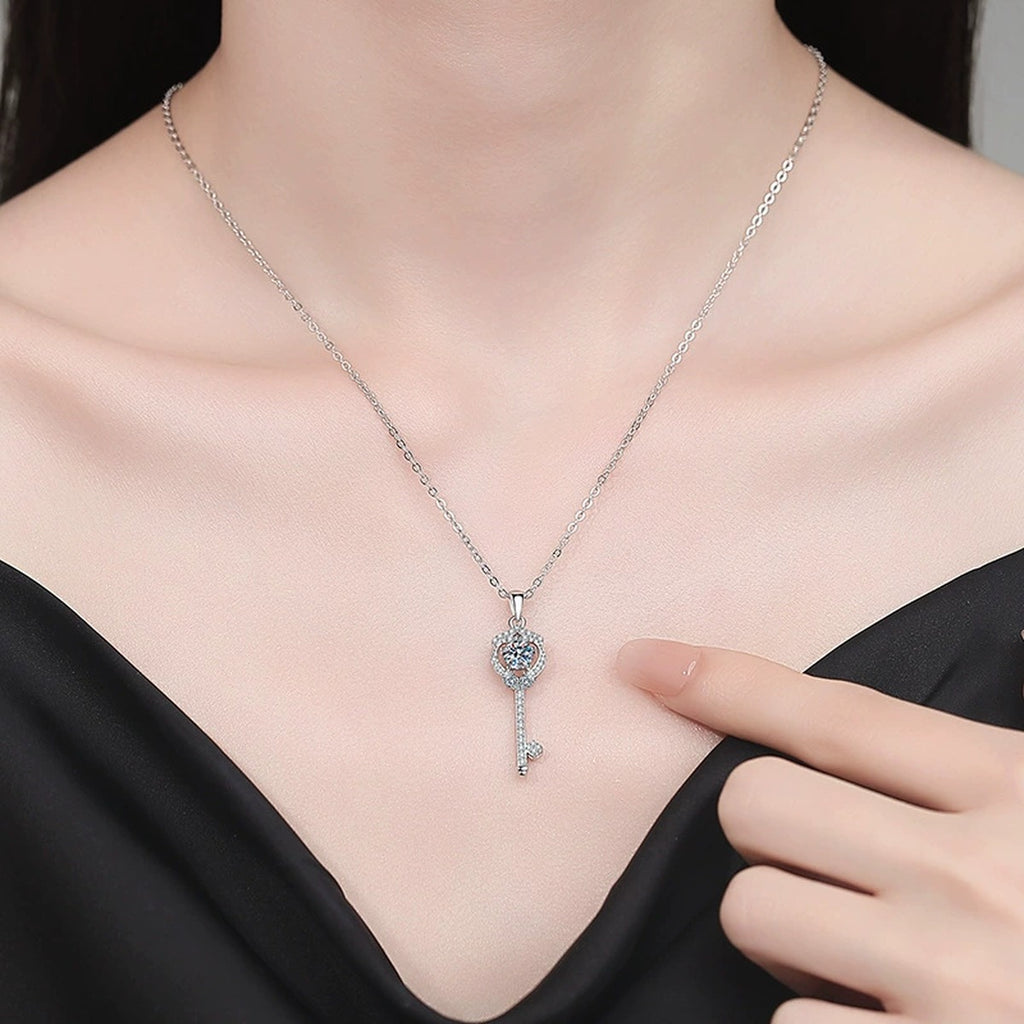 Slim Key Moissanite Pendant Necklace with Cubic Zirconia in Platinum-Plated S925 Sterling Silver worn on neckline by model