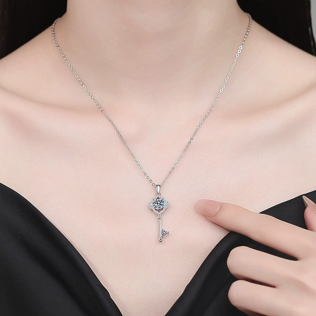 Pave Key Moissanite Pendant Necklace with Cubic Zirconia in Platinum-Plated S925 Sterling Silver worn on neckline by model