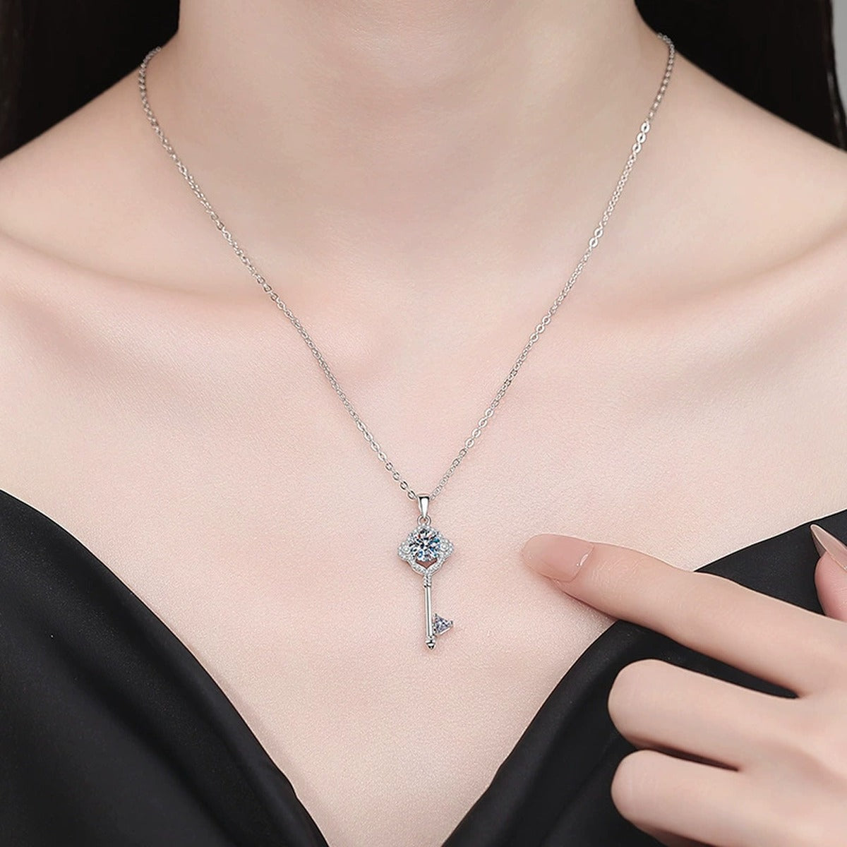 Pave Key Moissanite Pendant Necklace with Cubic Zirconia in Platinum-Plated S925 Sterling Silver worn on neckline by model