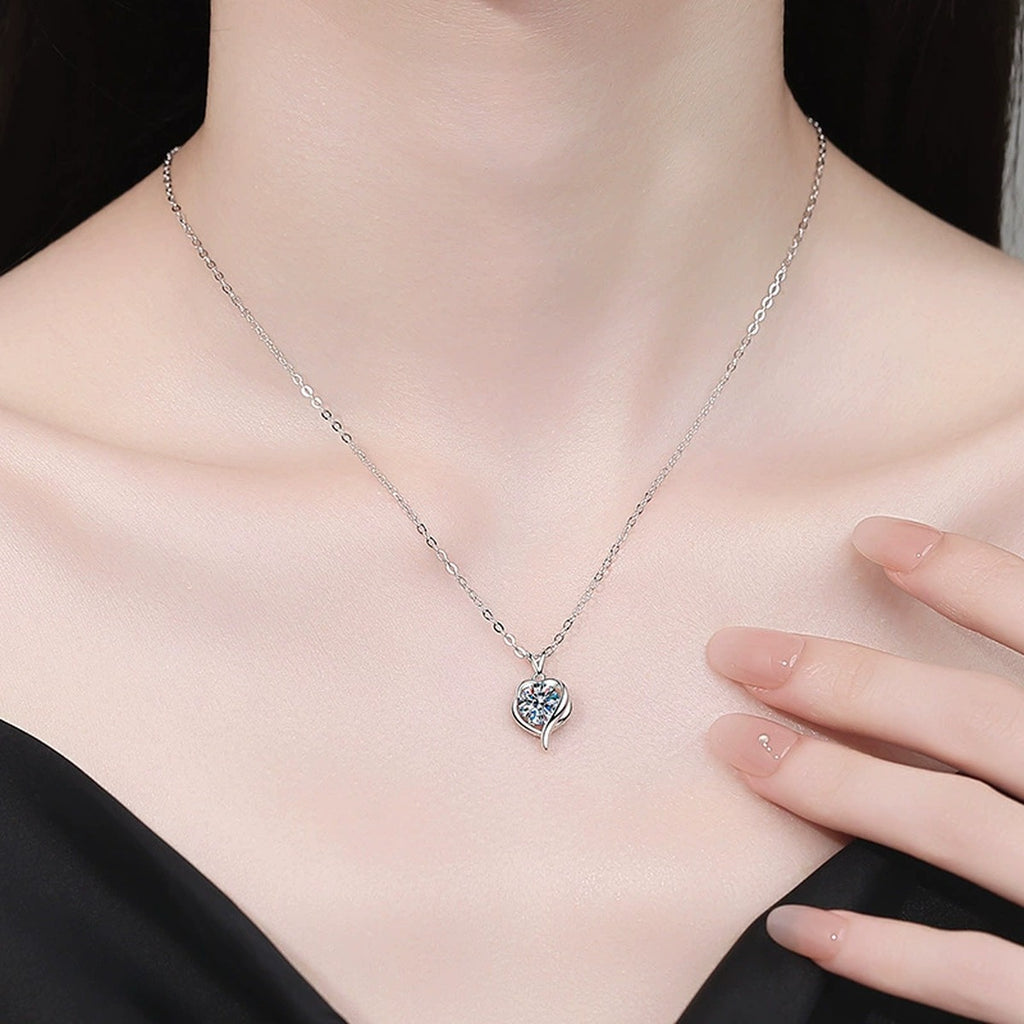 Heart Swirl Moissanite Pendant Necklace with Cubic Zirconia in Platinum-Plated S925 Sterling Silver worn on neckline by model
