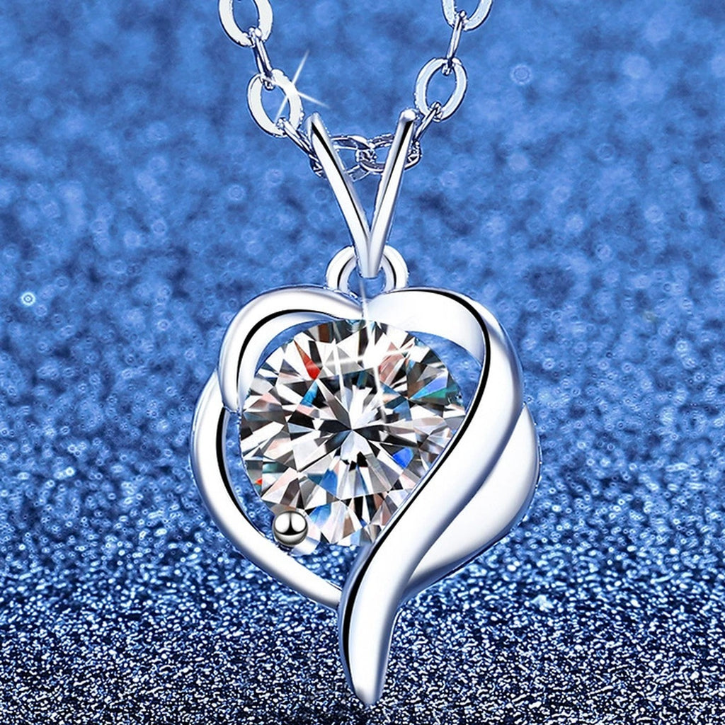Heart Swirl Moissanite Pendant Necklace with Cubic Zirconia in Platinum-Plated S925 Sterling Silver blue background angled view