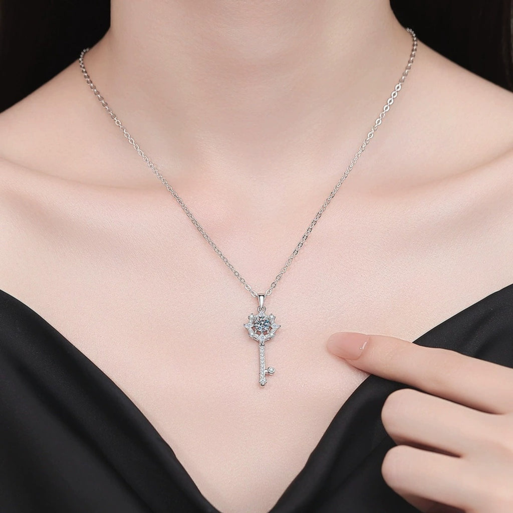 Snowflake Key Moissanite Pendant Necklace with Cubic Zirconia in Platinum-Plated S925 Sterling Silver worn on neckline by model