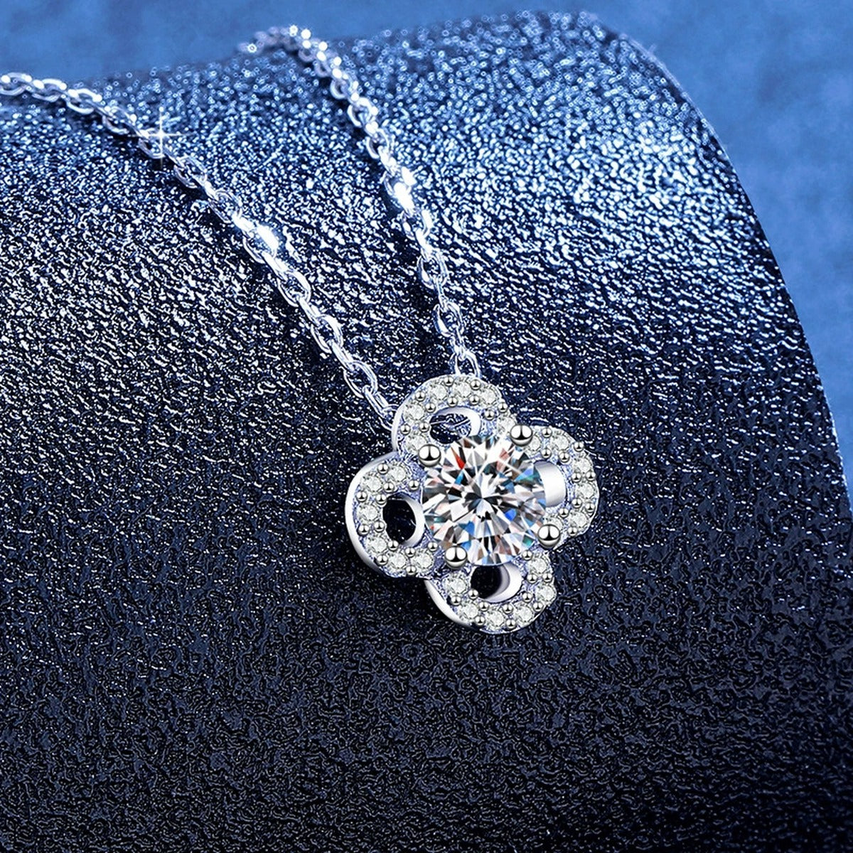 Clover Flower Moissanite Pendant Necklace with Cubic Zirconia in Platinum-Plated S925 Sterling Silver blue background product view