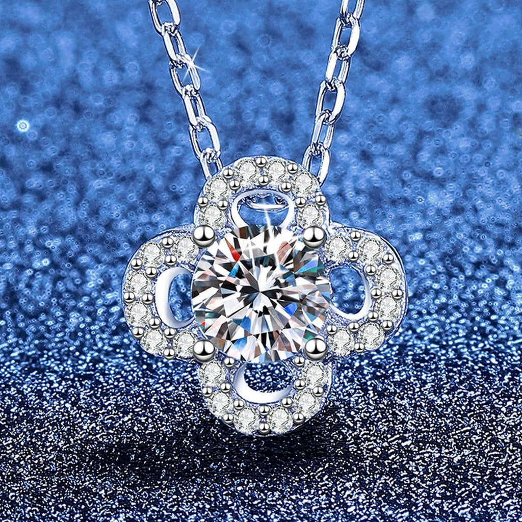 Clover Flower Moissanite Pendant Necklace with Cubic Zirconia in Platinum-Plated S925 Sterling Silver blue background angled view