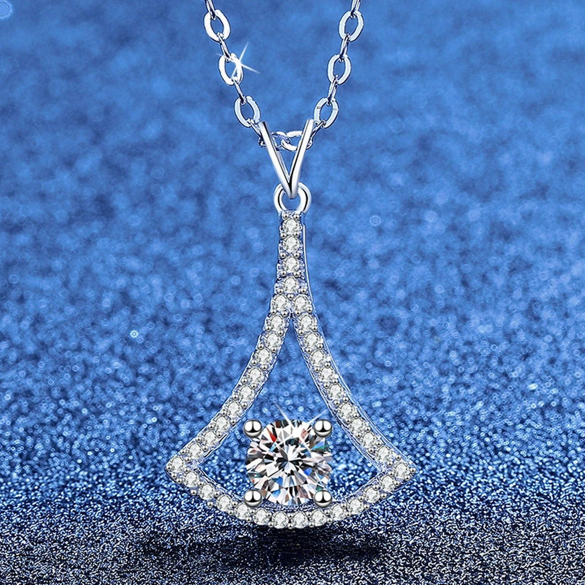 Fan Kite Moissanite Pendant Necklace with Cubic Zirconia in Platinum-Plated S925 Sterling Silver blue background angled view