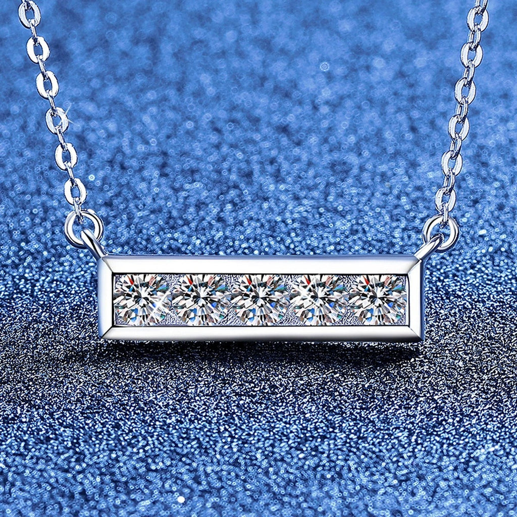 Five-Stone Moissanite Bar Necklace in Platinum-Plated S925 Sterling Silver blue background angled view