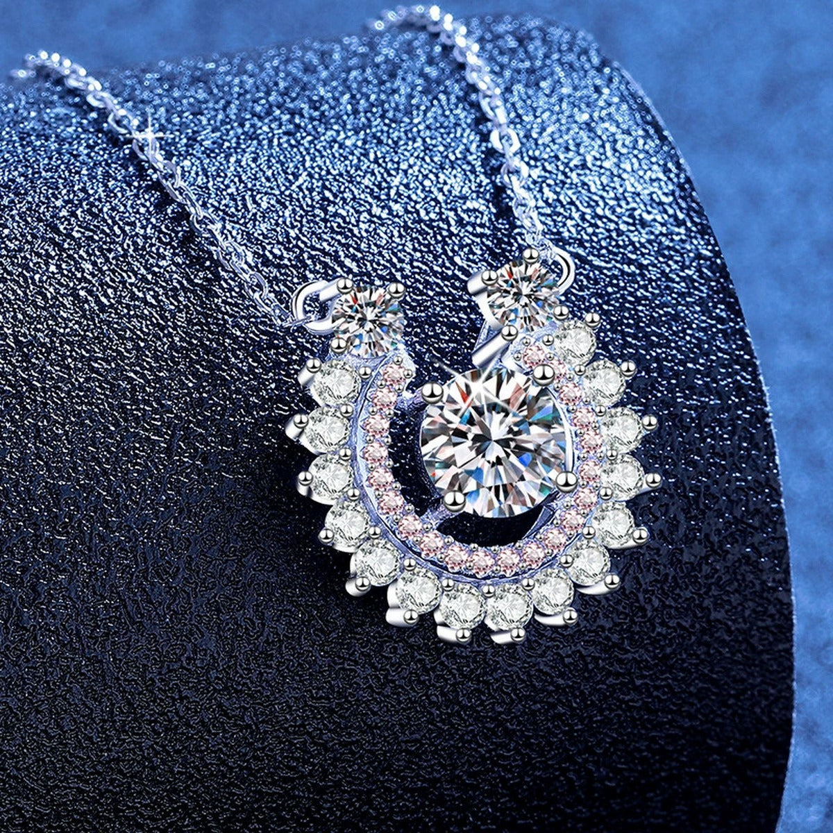 Sunburst Moissanite Pendant Necklace with Cubic Zirconia in Platinum-Plated S925 Sterling Silver blue background angled view