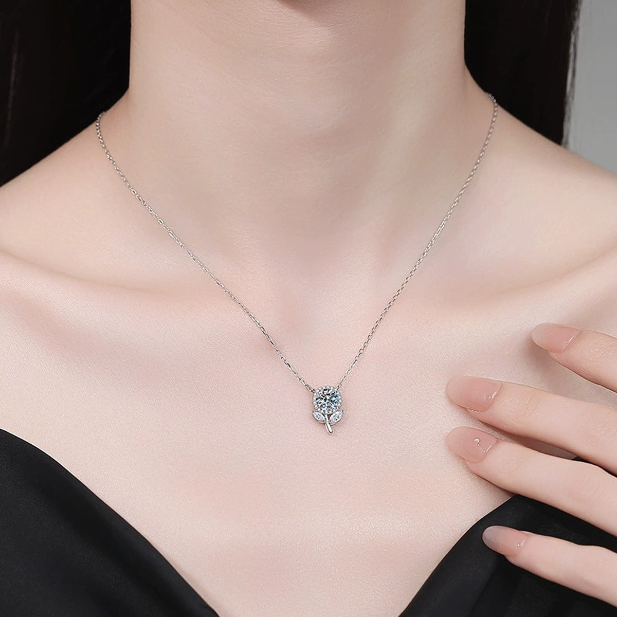 Floral Bud Moissanite Pendant Necklace with Cubic Zirconia in Platinum-Plated S925 Sterling Silver worn on neckline by model