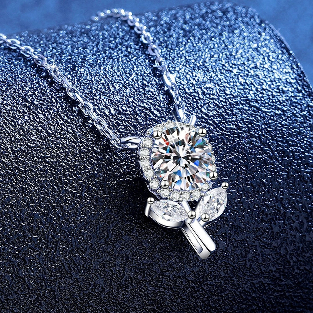 Floral Bud Moissanite Pendant Necklace with Cubic Zirconia in Platinum-Plated S925 Sterling Silver blue background angled view