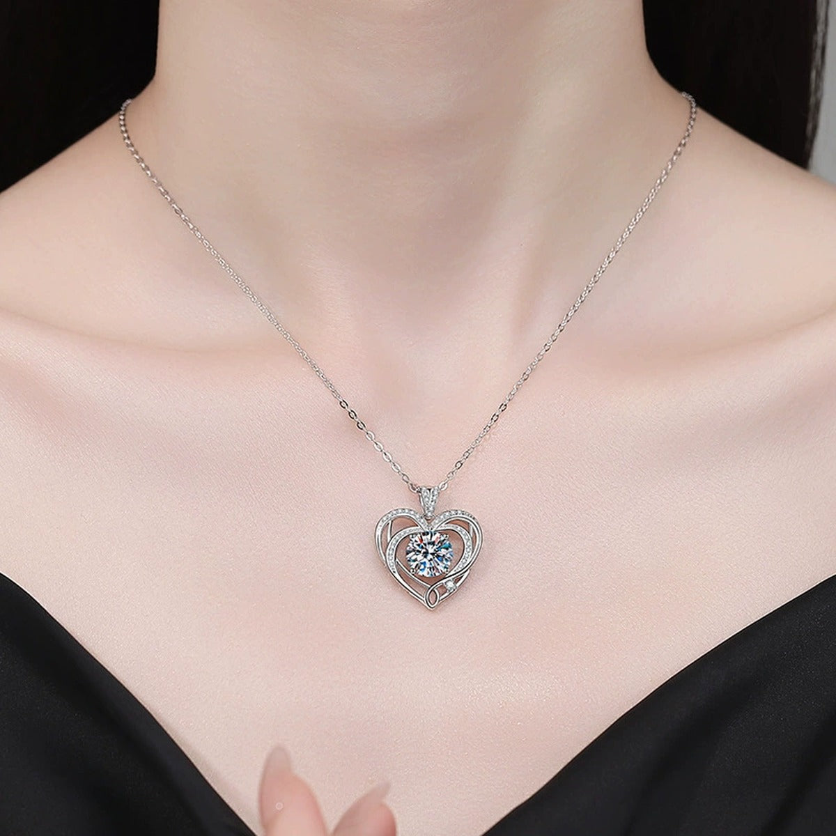 Open Heart Moissanite Pendant Necklace with Cubic Zirconia in Platinum-Plated S925 Sterling Silver worn on neckline by model