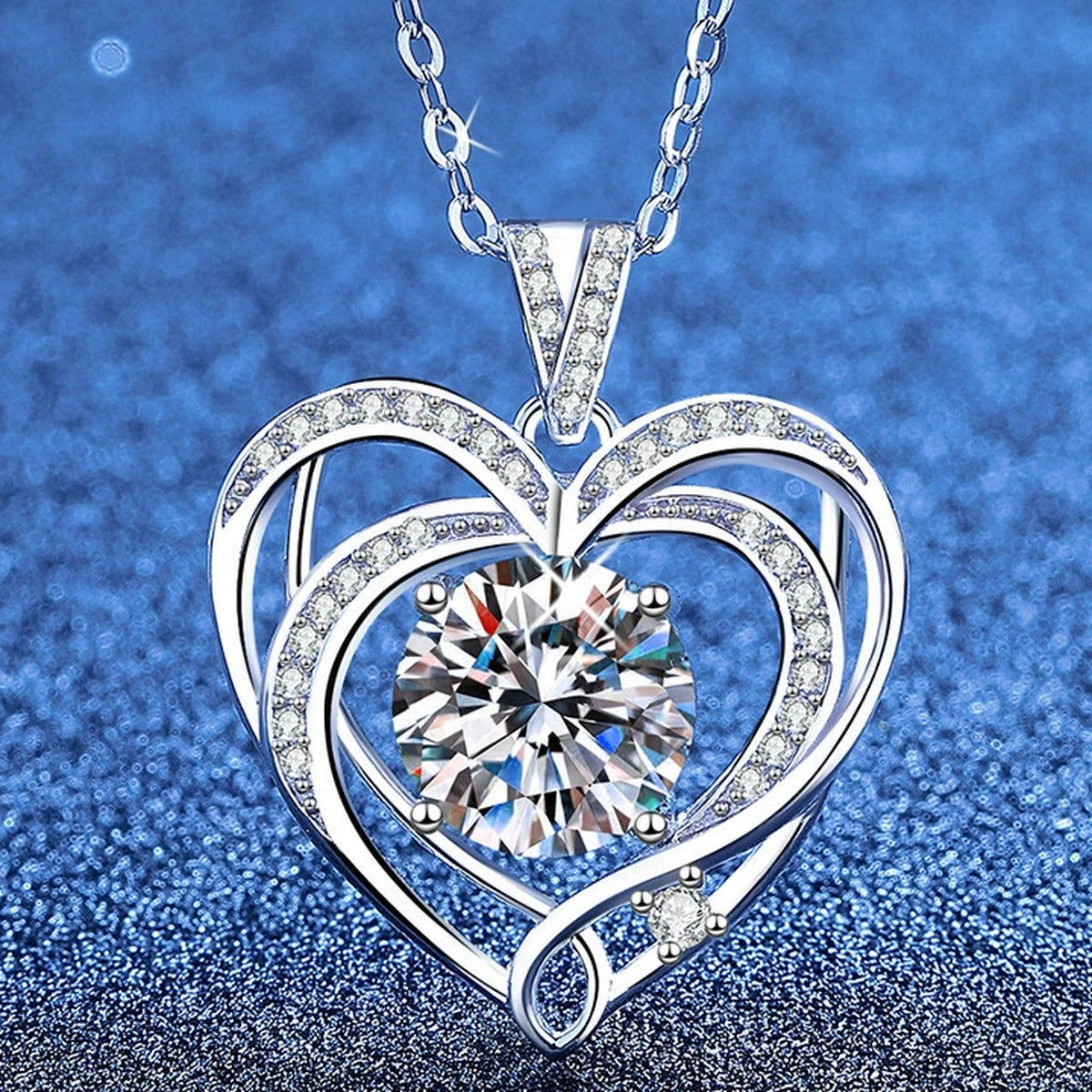 Open Heart Moissanite Pendant Necklace with Cubic Zirconia in Platinum-Plated S925 Sterling Silver blue background product view