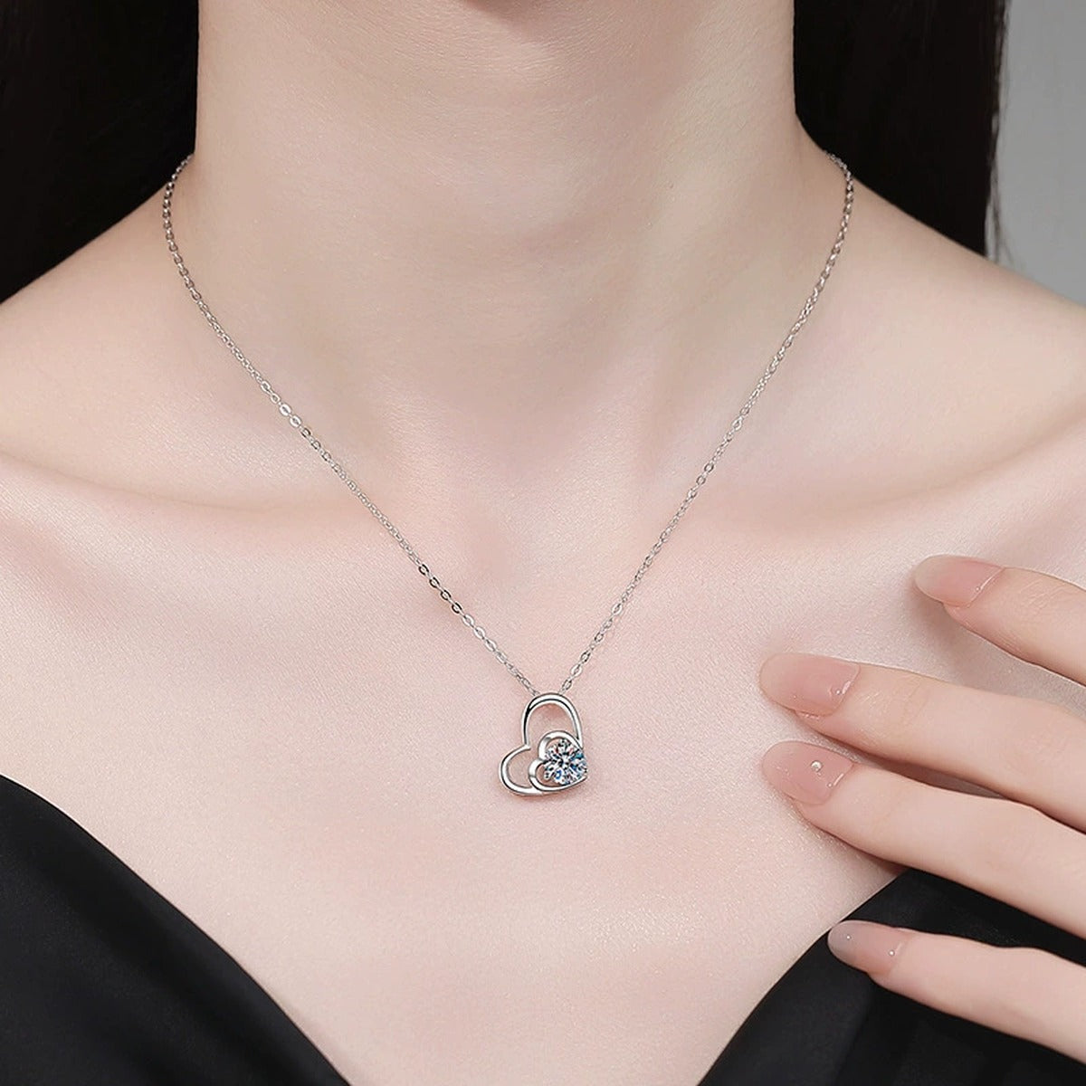 Double Heart Moissanite Pendant Necklace with Cubic Zirconia in White Gold-Plated S925 Sterling Silver worn on neckline by model