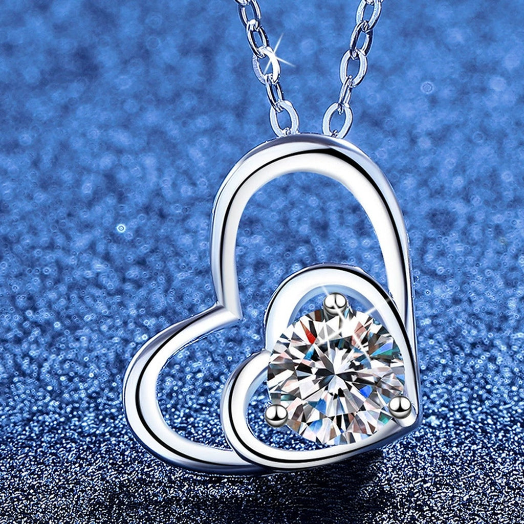 Double Heart Moissanite Pendant Necklace with Cubic Zirconia in White Gold-Plated S925 Sterling Silver blue background angled view