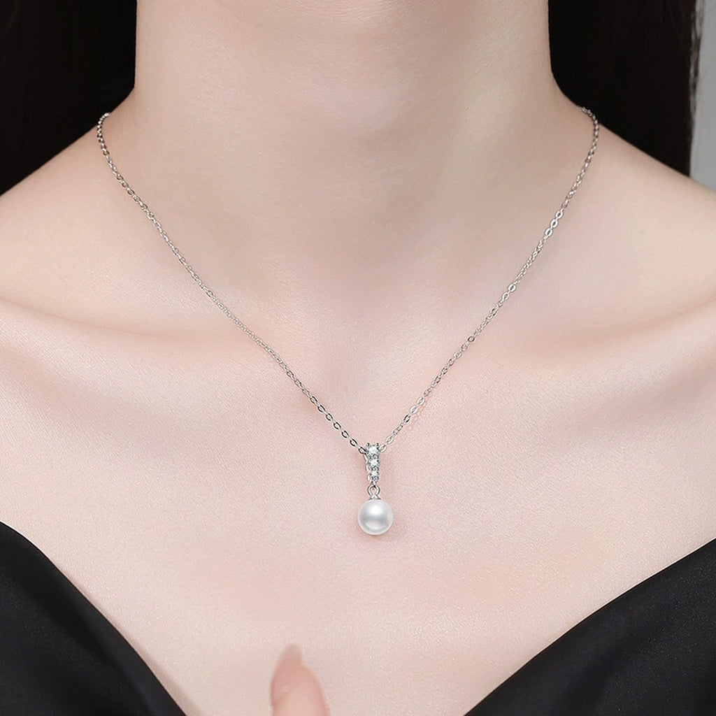 Pearl Bar Moissanite Pendant Necklace in Platinum-Plated S925 Sterling Silver worn on neckline by model