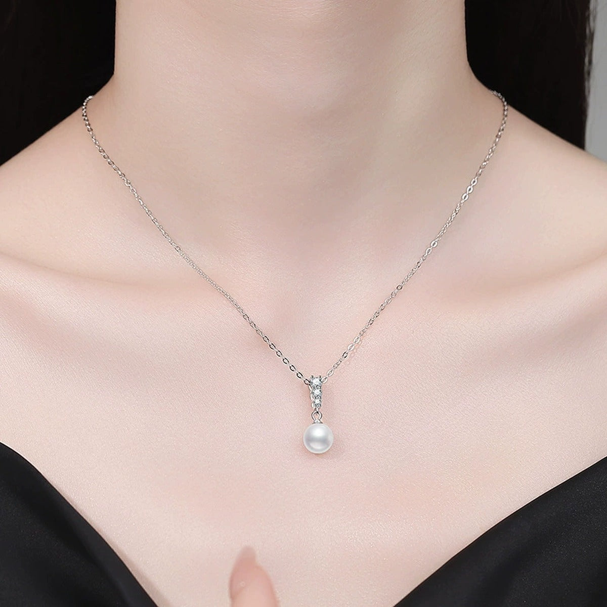 Pearl Bar Moissanite Pendant Necklace in Platinum-Plated S925 Sterling Silver worn on neckline by model
