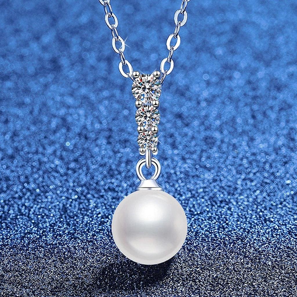 Pearl Bar Moissanite Pendant Necklace in Platinum-Plated S925 Sterling Silver blue background angled view