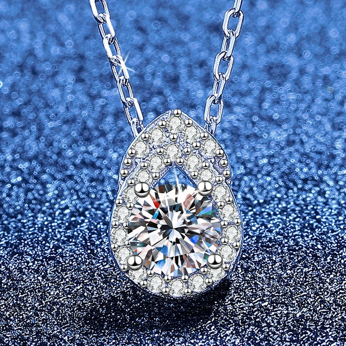 Pear Teardrop Moissanite Pendant Necklace with Cubic Zirconia in Platinum-Plated S925 Sterling Silver blue background product view