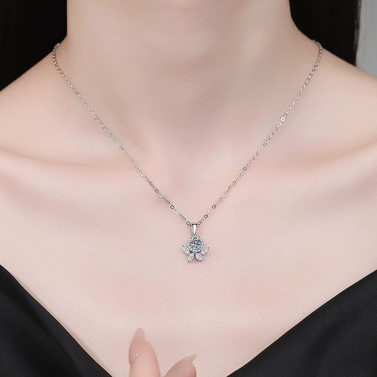 Star Flower Moissanite Pendant Necklace with Cubic Zirconia in Platinum-Plated S925 Sterling Silver worn on neckline by model