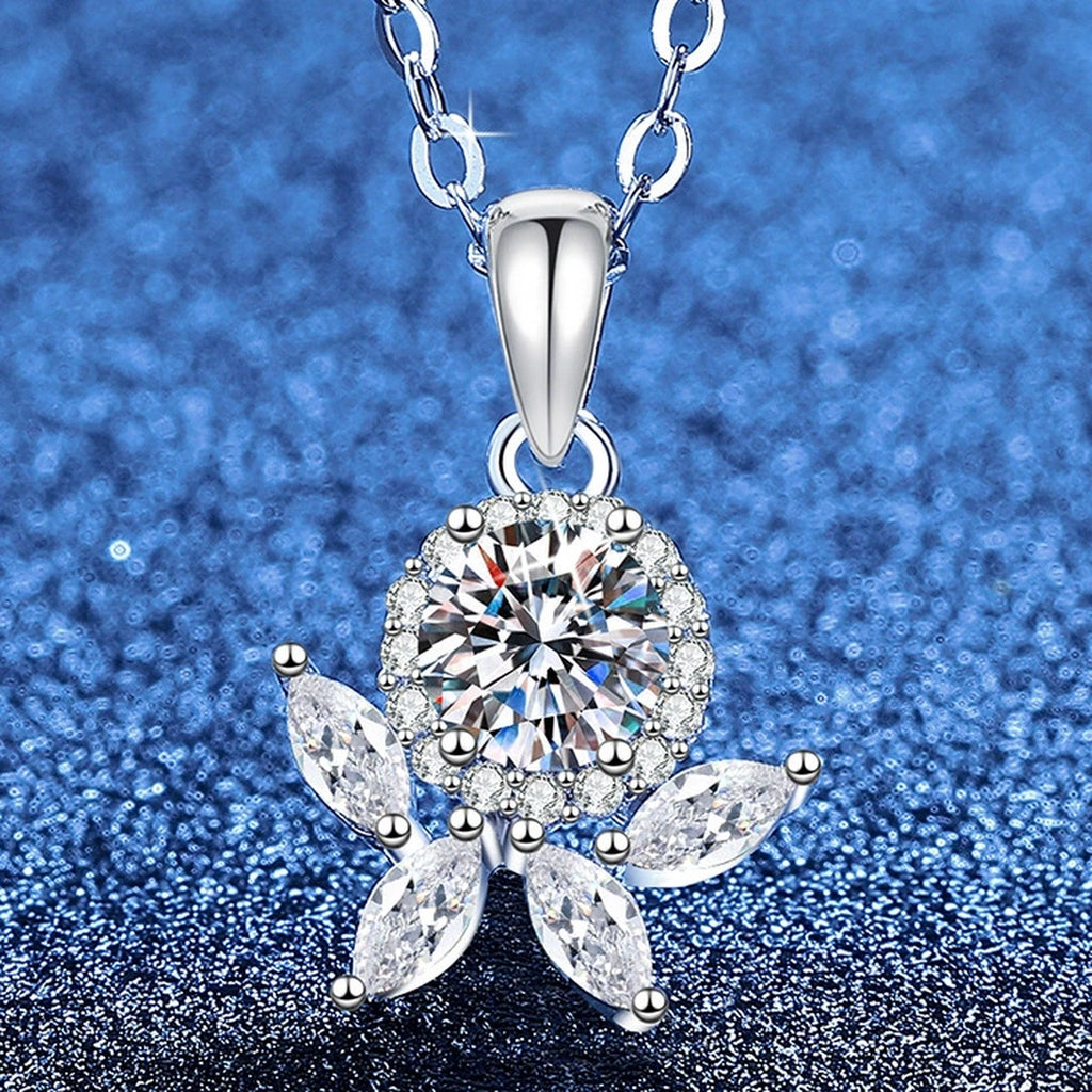 Star Flower Moissanite Pendant Necklace with Cubic Zirconia in Platinum-Plated S925 Sterling Silver blue background angled view