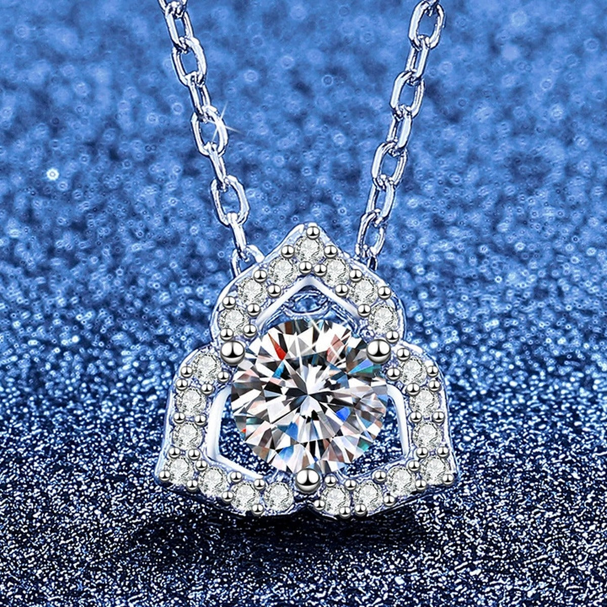 Square Halo Moissanite Pendant Necklace with Cubic Zirconia in Platinum-Plated S925 Sterling Silver blue background angled view