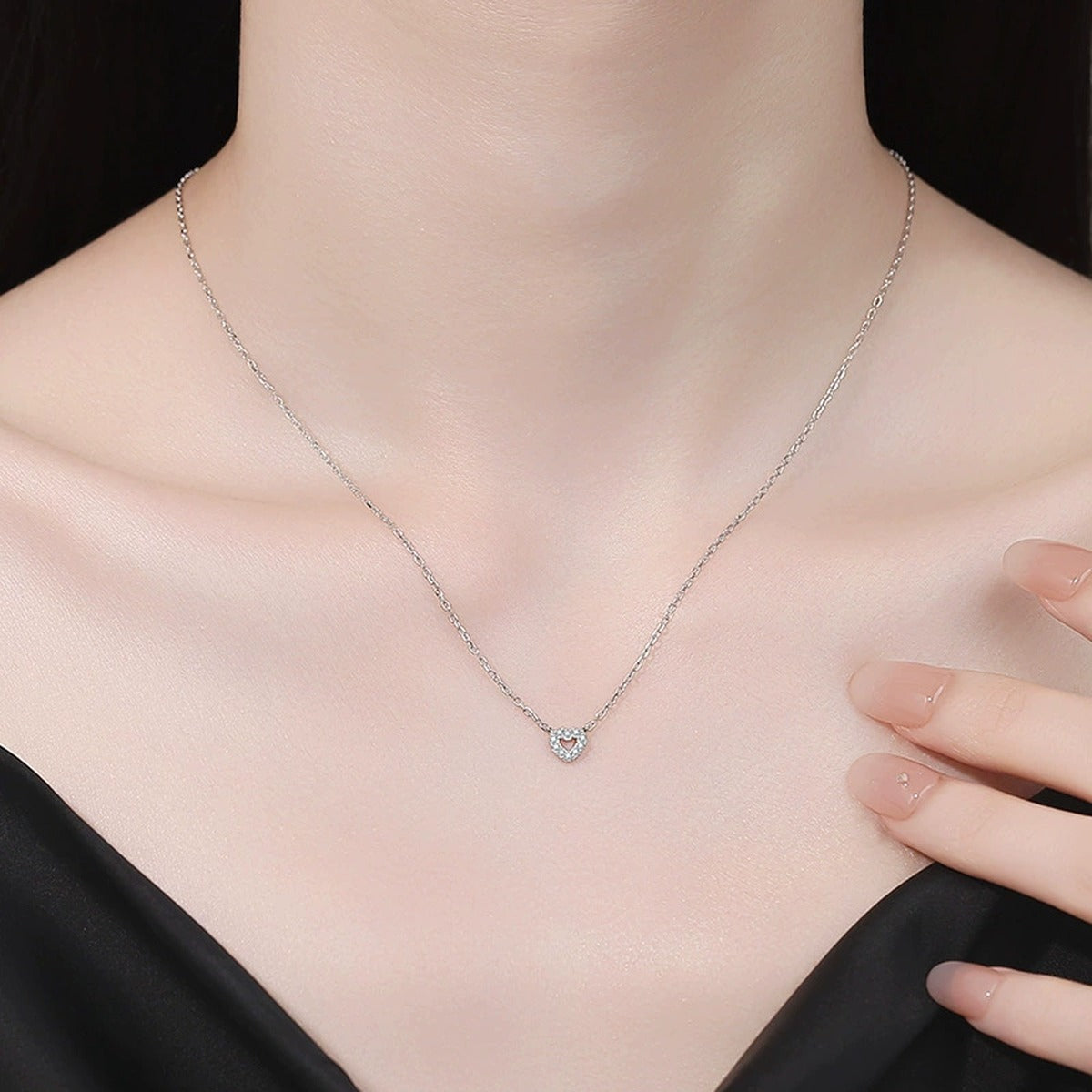 Heart Moissanite Pendant Necklace in S925 Sterling Silver worn on neckline by model