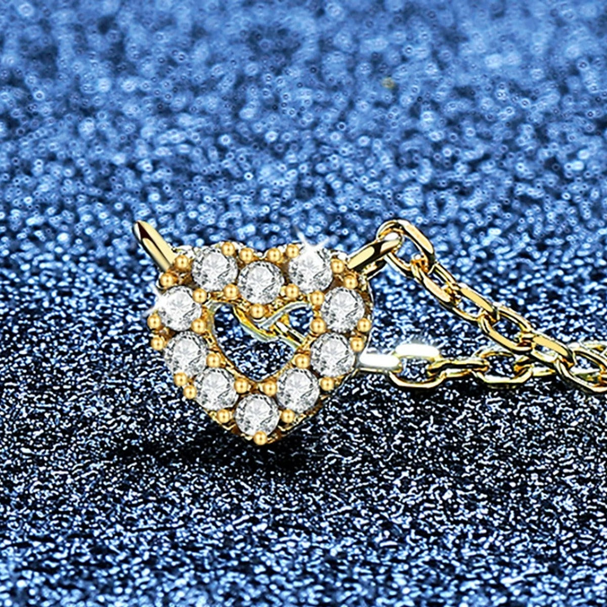 Heart Moissanite Pendant Necklace in S925 Sterling Silver blue background angled view
