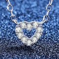 Heart Moissanite Pendant Necklace in S925 Sterling Silver blue background close-up view