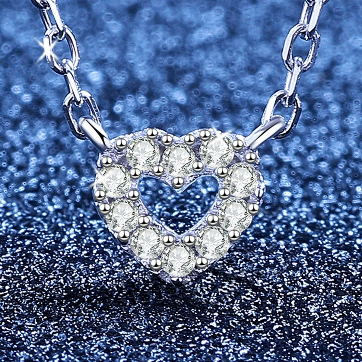 Heart Moissanite Pendant Necklace in S925 Sterling Silver blue background close-up view