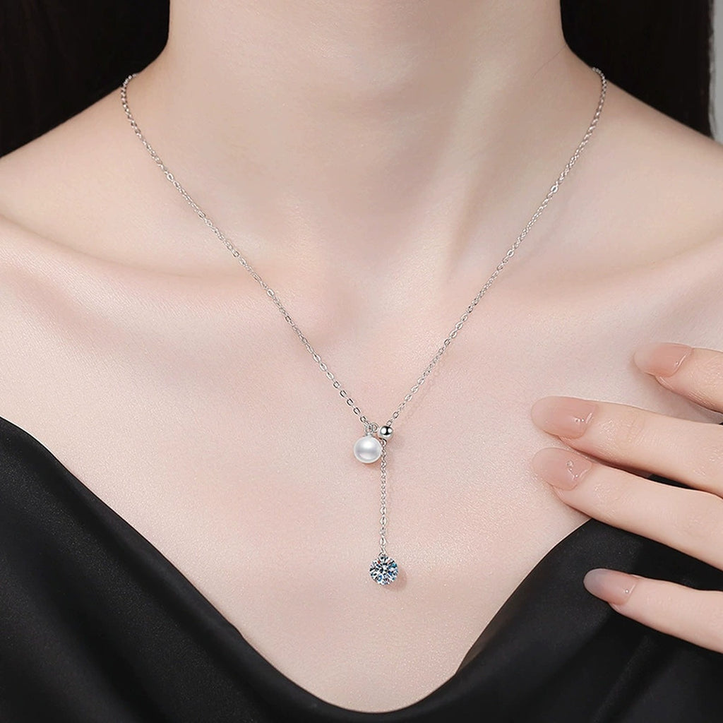 Pearl Lariat Moissanite Pendant Necklace in Platinum-Plated S925 Sterling Silver worn on neckline by model