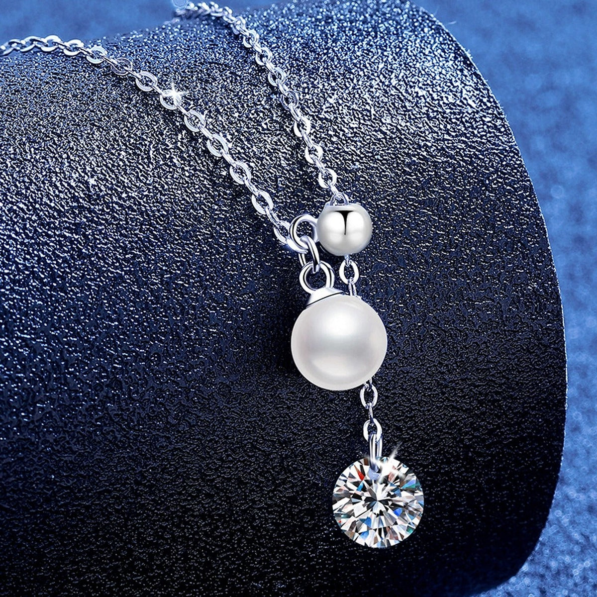 Pearl Lariat Moissanite Pendant Necklace in Platinum-Plated S925 Sterling Silver blue background product view