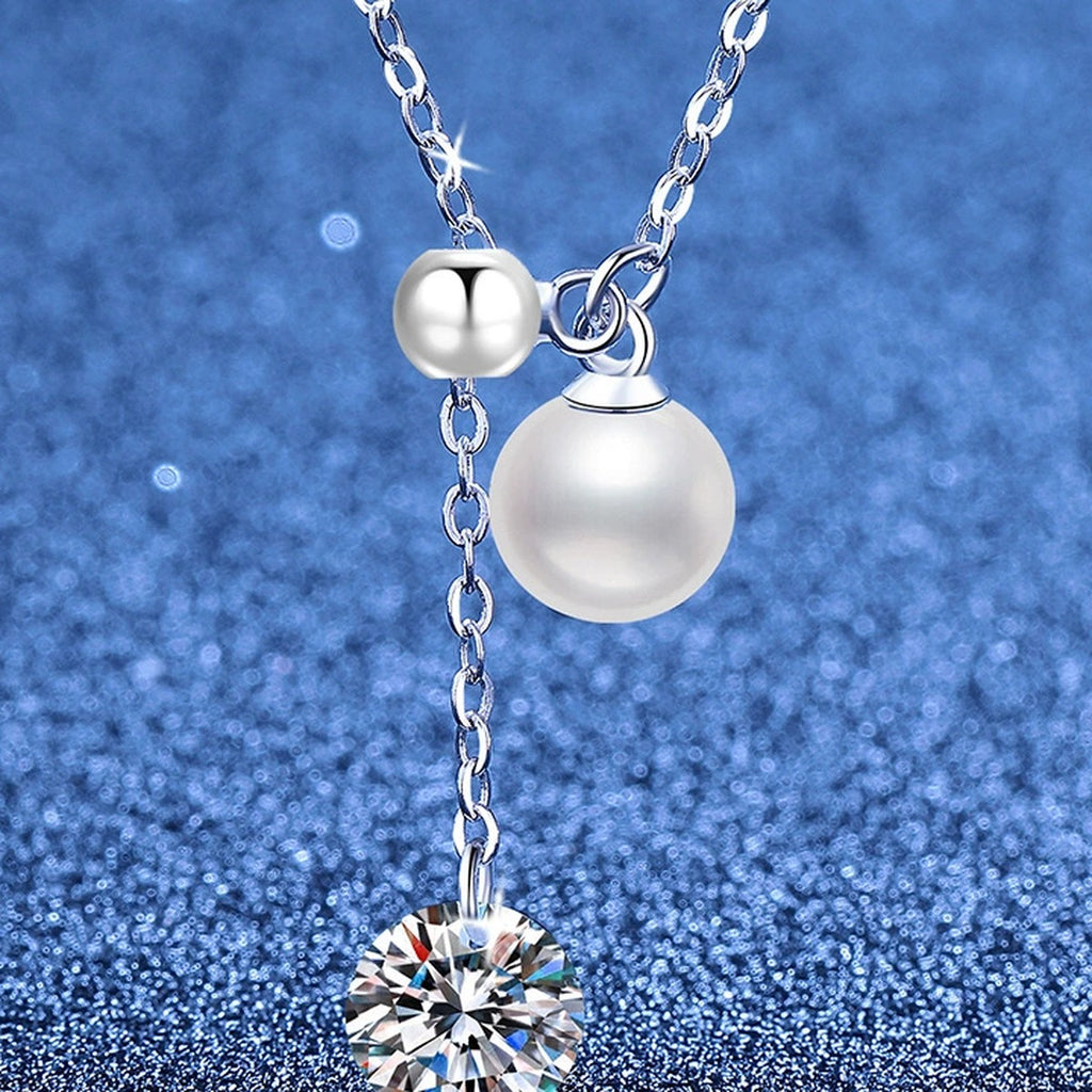 Pearl Lariat Moissanite Pendant Necklace in Platinum-Plated S925 Sterling Silver blue background angled view