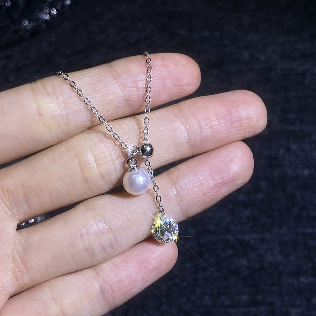 Pearl Lariat Moissanite Pendant Necklace in Platinum-Plated S925 Sterling Silver close-up product detail view